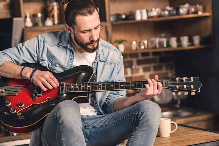 Man playing the guitar