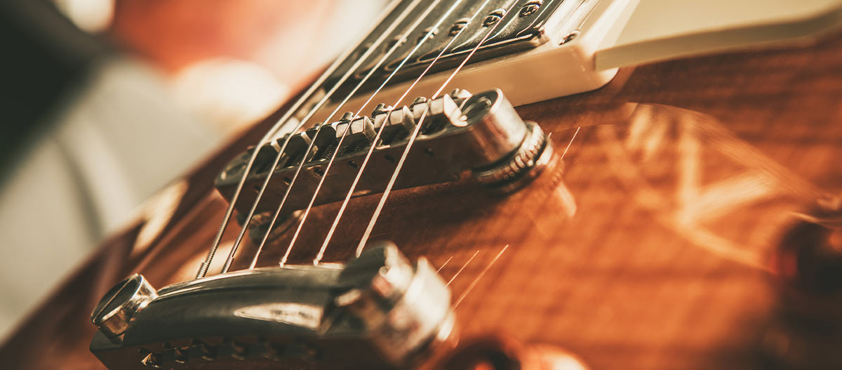 Premium electric guitar close up showing exotic wood finish and craftsmanship