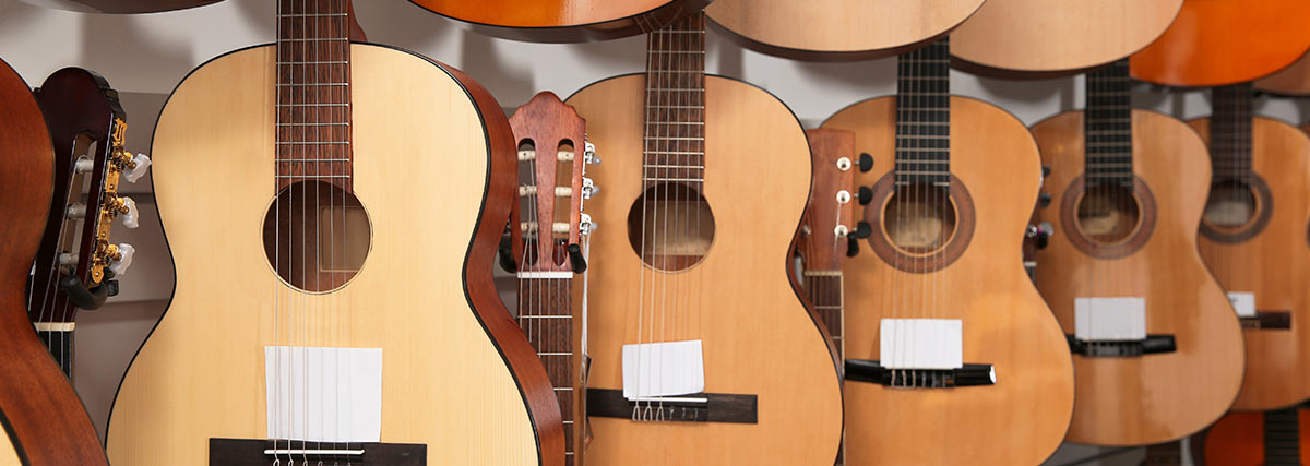 Acoustic guitars on display showing how wooden guitars can be affected by humidity