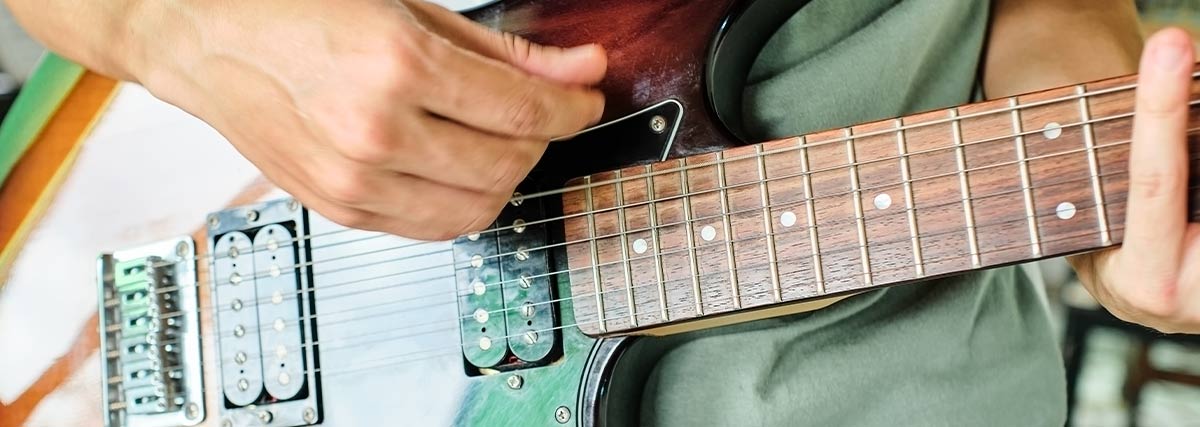 Close up of an electric guitarist playing